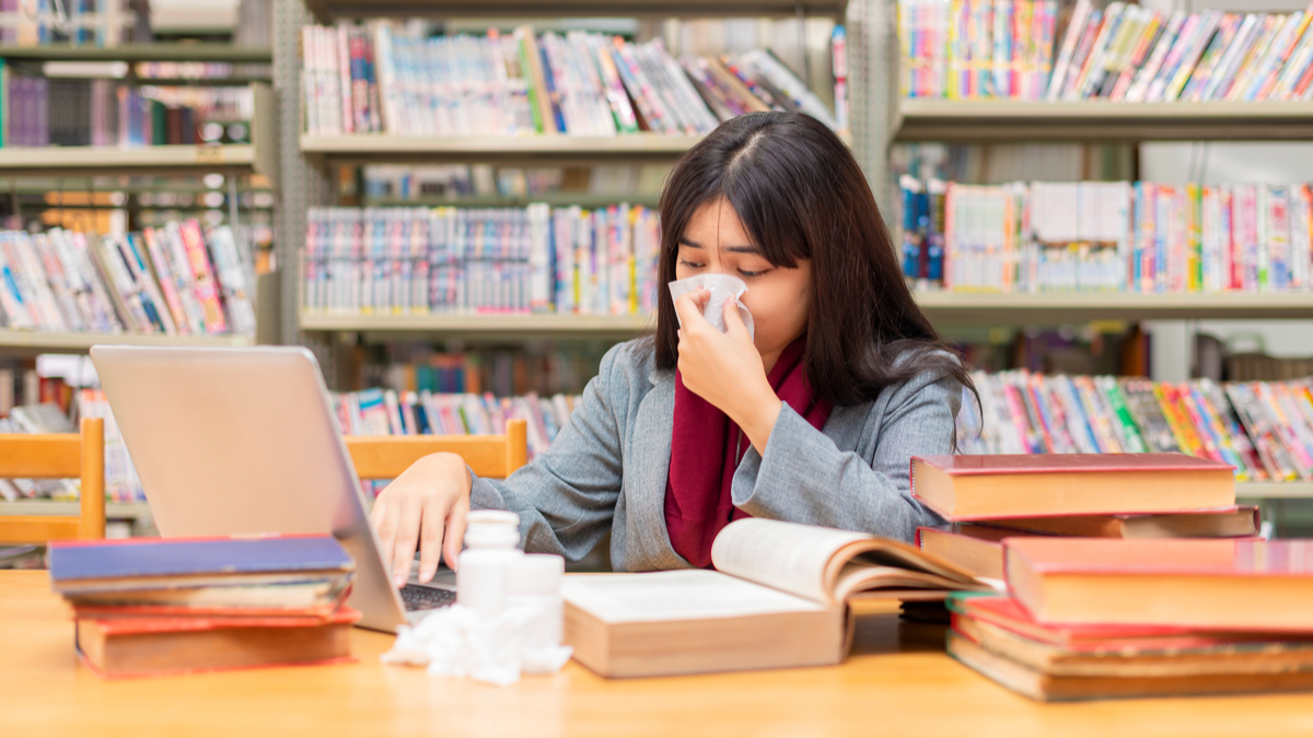 college student feeling sick